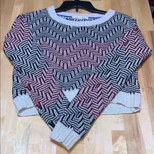 Black beige and red sweatshirt